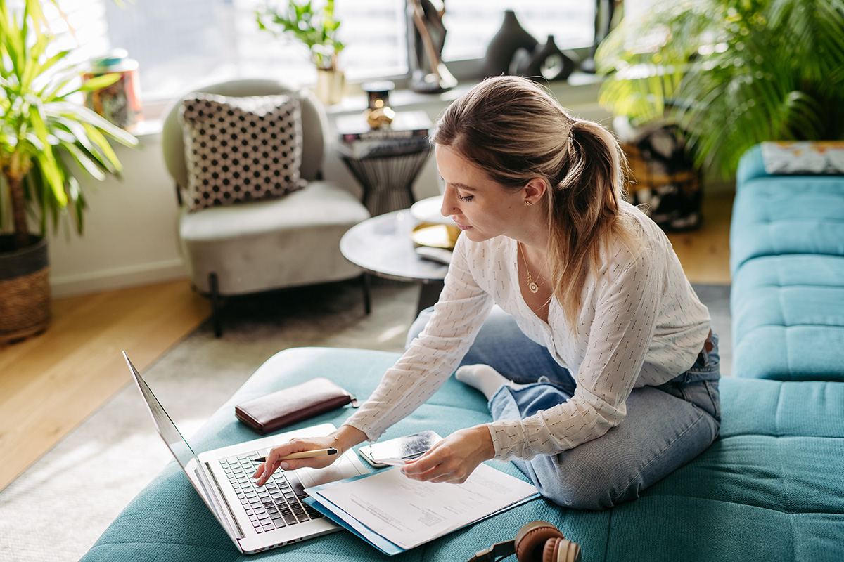 woman working at computer on her emergency fund